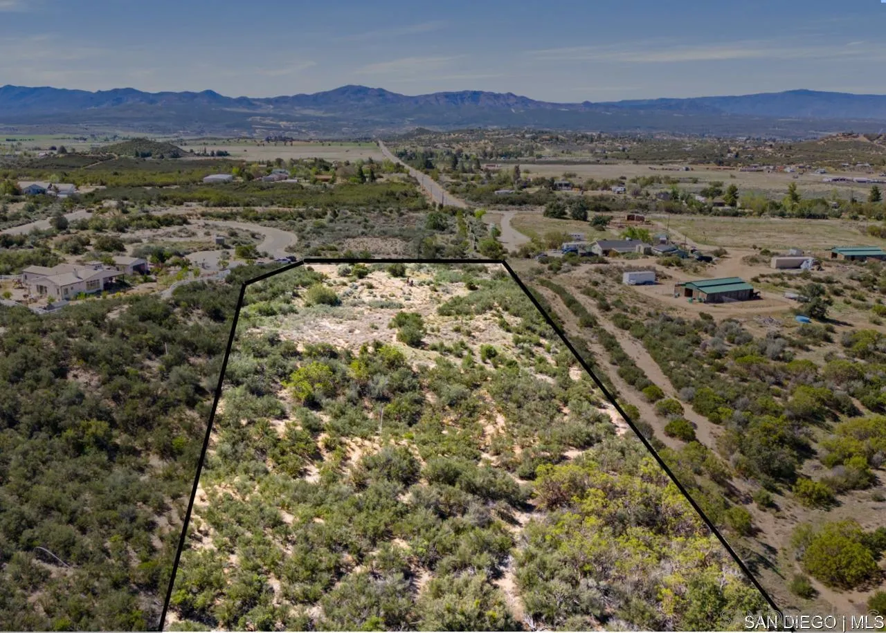 55001 Roadrunner Way, Unit 3 Anza, CA 92539 - Photo 3 of 11 an aerial view of residential houses with outdoor space