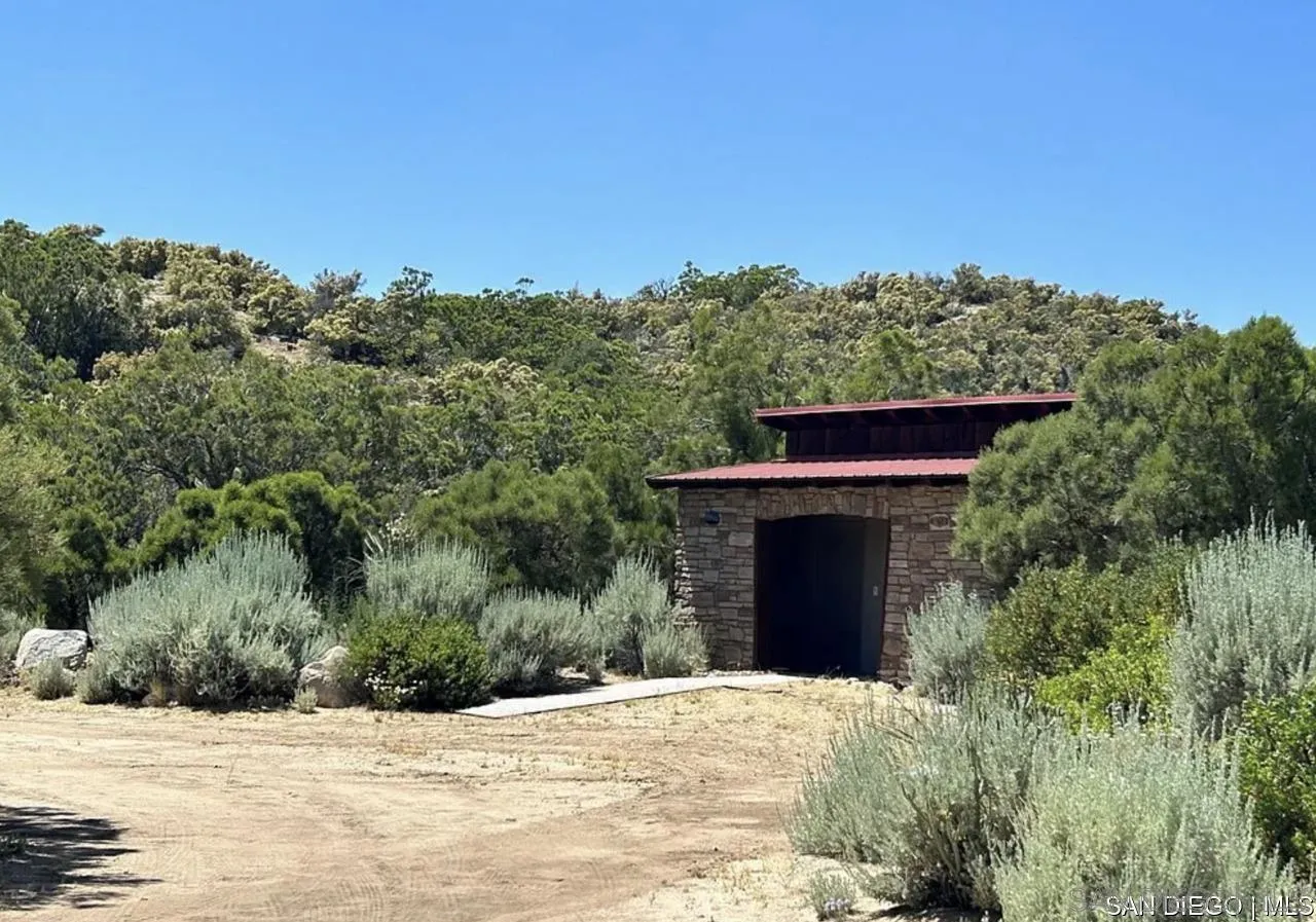 55001 Roadrunner Way, Unit 3 Anza, CA 92539 - Photo 10 of 11 a front view of a house with a yard