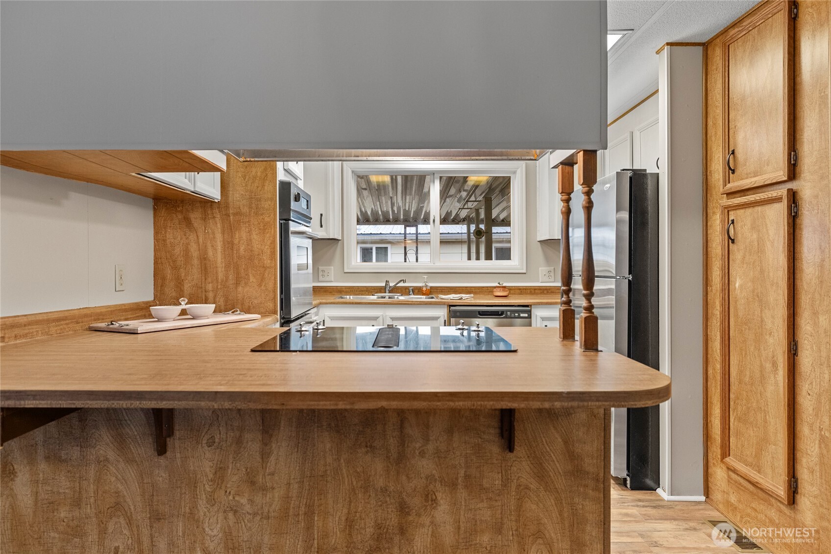 2725 East Fir Street, Unit 41 Mount Vernon, WA 98273 - Photo 11 of 38 a dining table with chairs and window