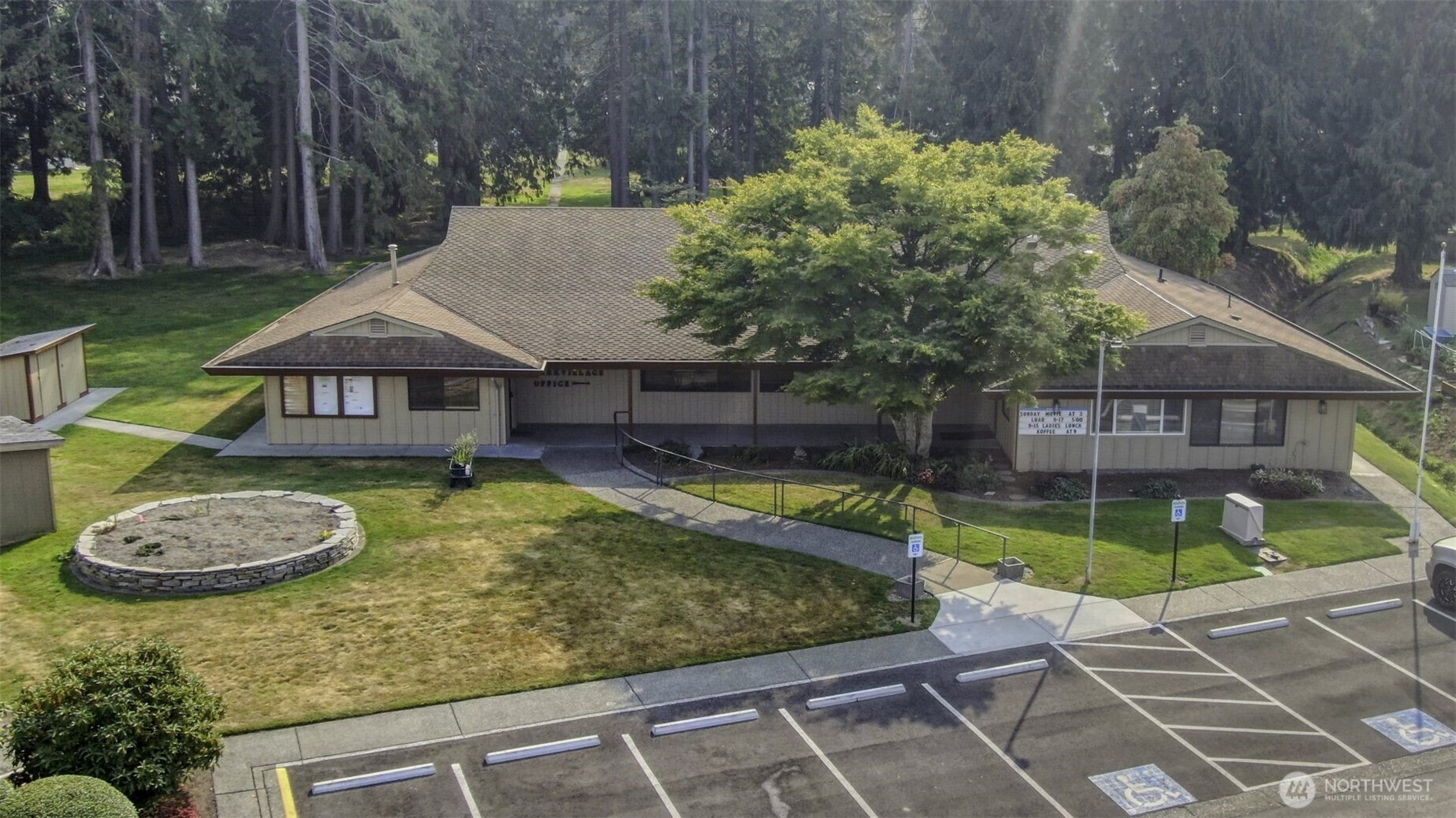 2725 East Fir Street, Unit 41 Mount Vernon, WA 98273 - Photo 32 of 38 a view of a house with a swimming pool and sitting area