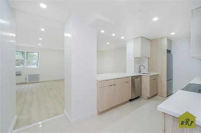 a large bathroom with a double vanity sink a mirror and a shower