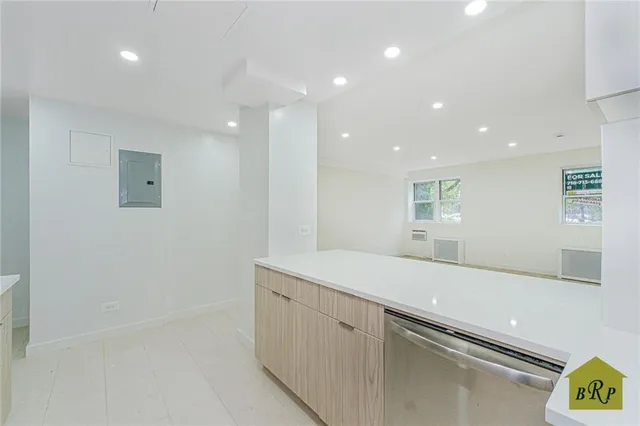 a view of a kitchen with a sink and dishwasher