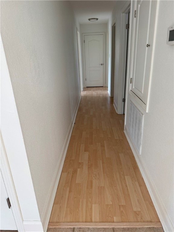 1132 Fifth Street Comfort, TX 78013 - Photo 15 of 20 a view of a hallway with wooden floor