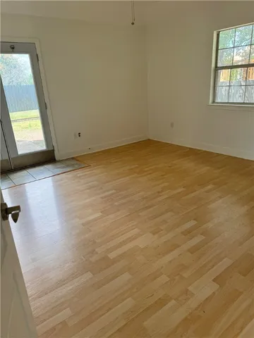 a view of a bathroom with a toilet and a window