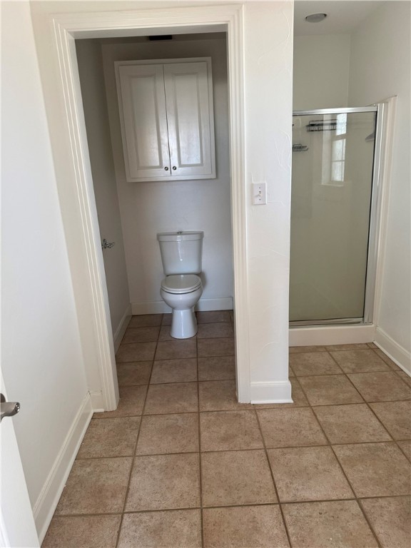 1132 Fifth Street Comfort, TX 78013 - Photo 19 of 20 a view of a bathroom with a toilet and a window
