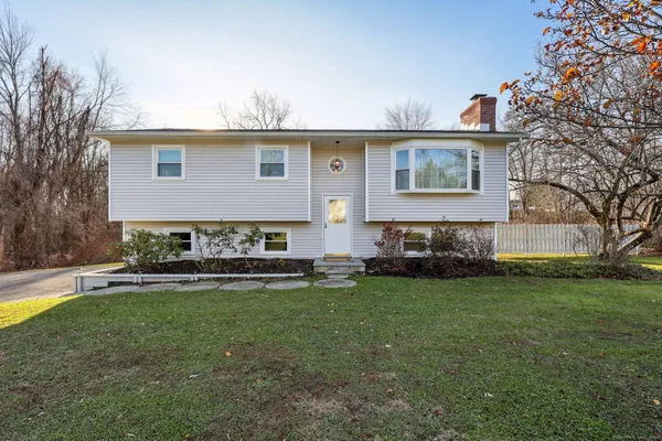 front view of a house with a yard