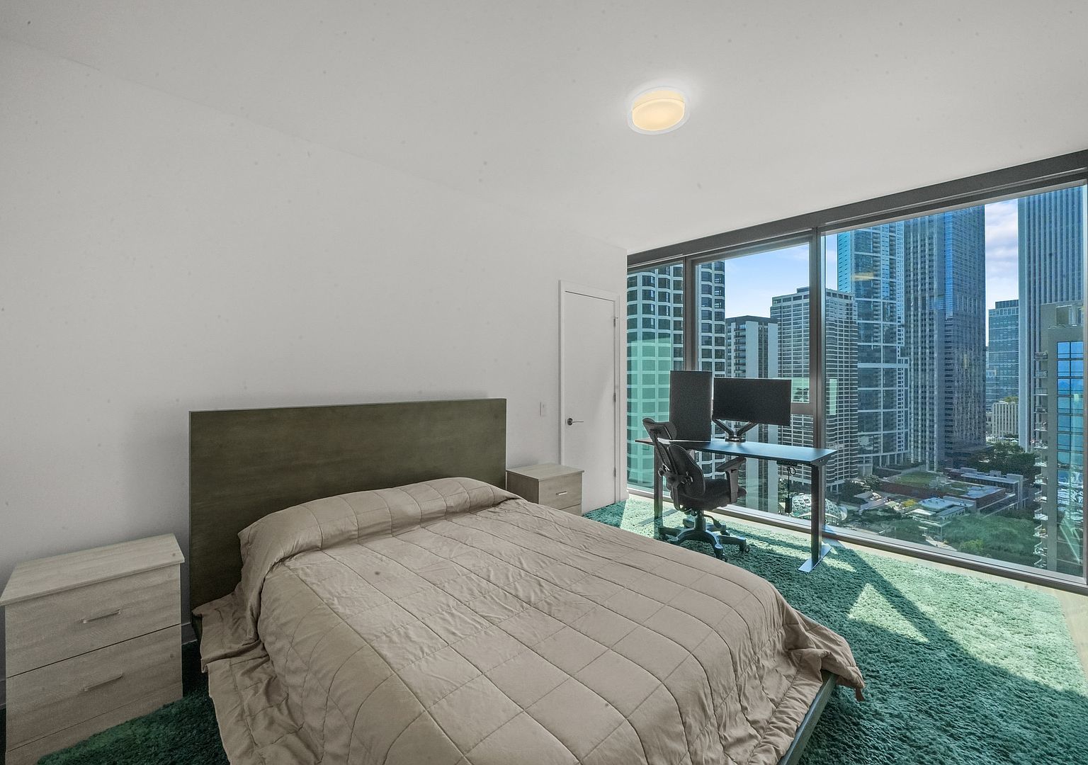 211 North Harbor Drive, Unit 2203 Chicago, IL 60601 - Photo 15 of 56 a bedroom with a bed and a television