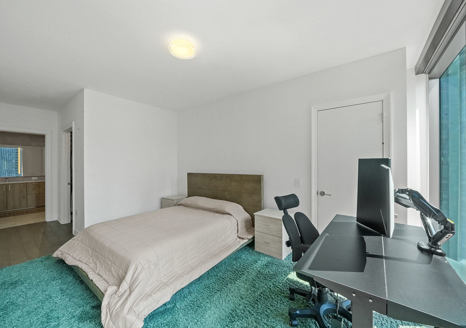 211 North Harbor Drive, Unit 2203 Chicago, IL 60601 - Photo 17 of 56 a bedroom with a bed and a desk