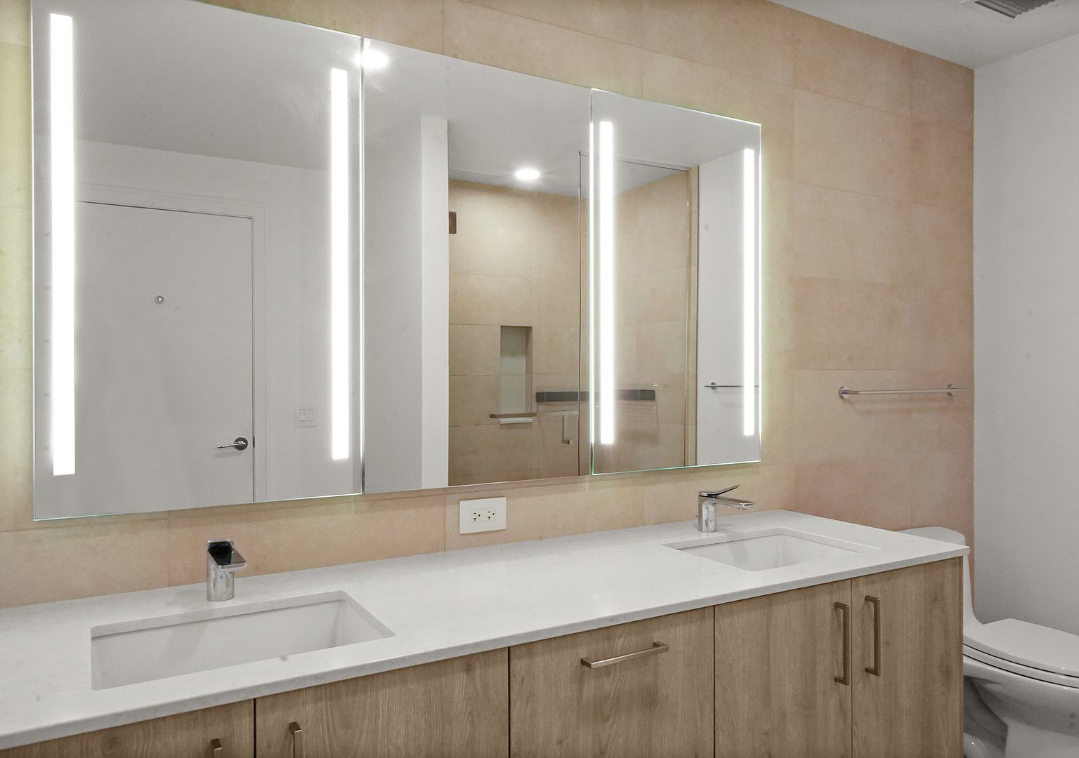 211 North Harbor Drive, Unit 2203 Chicago, IL 60601 - Photo 18 of 56 a bathroom with a sink and a mirror