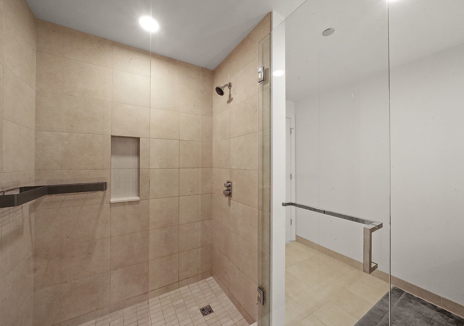 211 North Harbor Drive, Unit 2203 Chicago, IL 60601 - Photo 20 of 56 a bathroom with a shower and a glass door