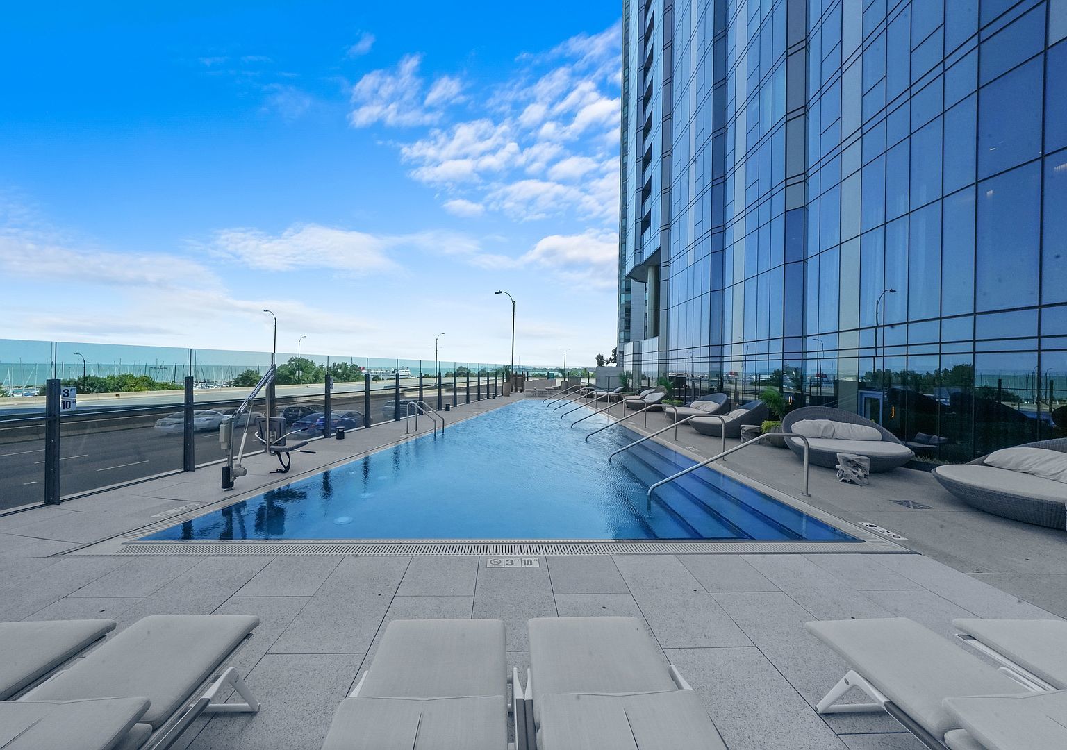 211 North Harbor Drive, Unit 2203 Chicago, IL 60601 - Photo 26 of 56 a view of a swimming pool with a patio