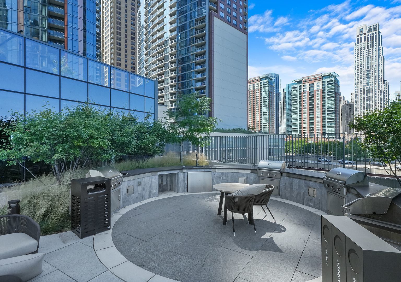 211 North Harbor Drive, Unit 2203 Chicago, IL 60601 - Photo 35 of 56 a swimming pool with outdoor seating and plants