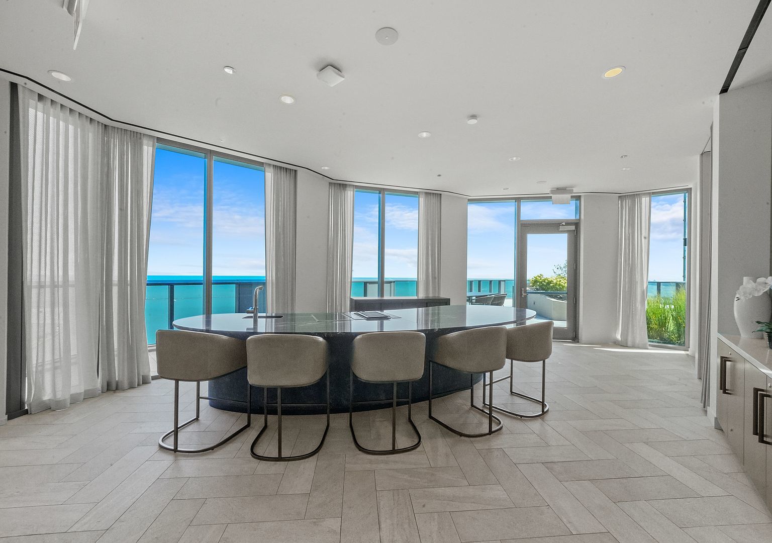 211 North Harbor Drive, Unit 2203 Chicago, IL 60601 - Photo 52 of 56 a dining room with furniture and large windows
