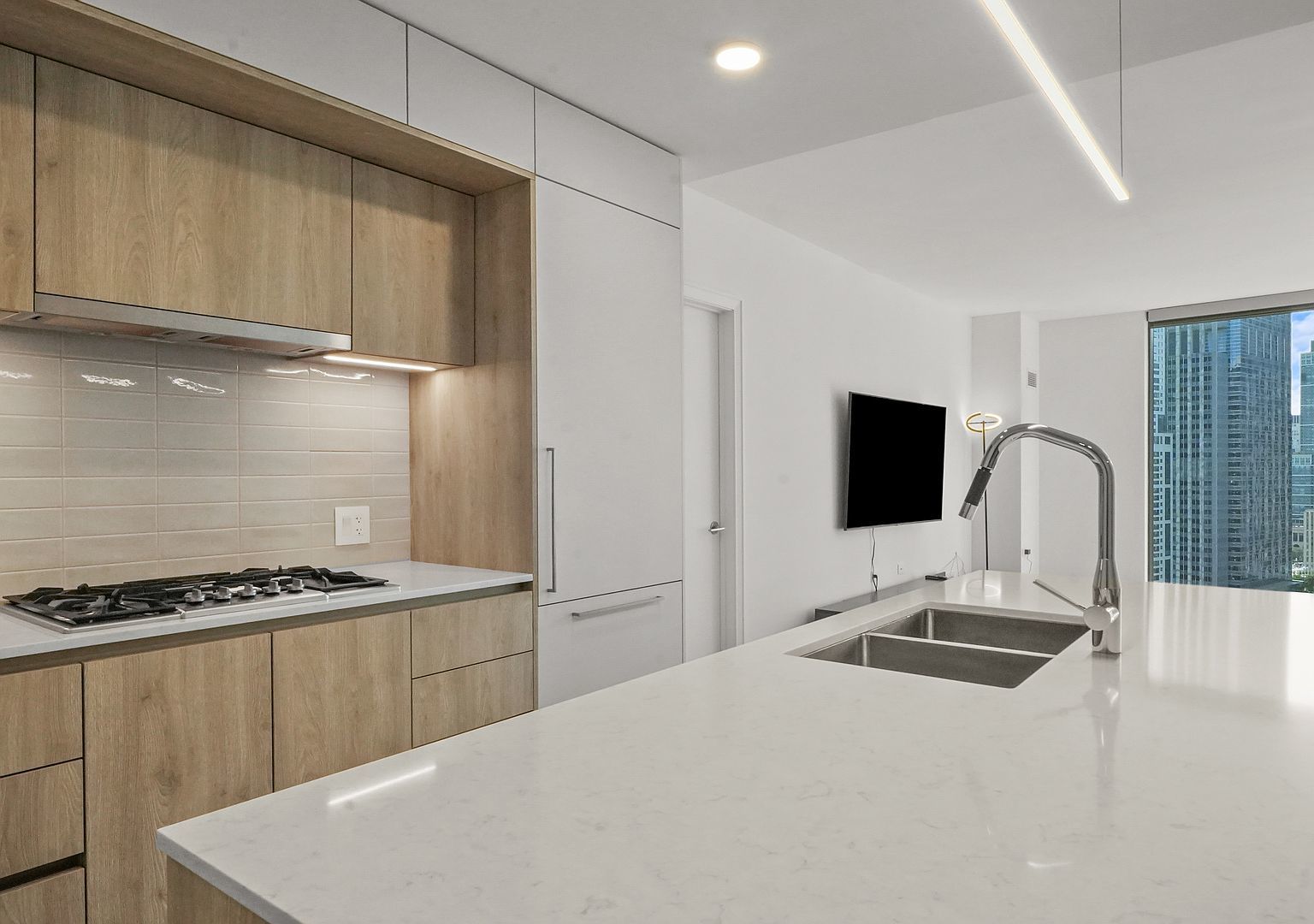 211 North Harbor Drive, Unit 2203 Chicago, IL 60601 - Photo 6 of 56 a bedroom with a bed and a flat screen tv