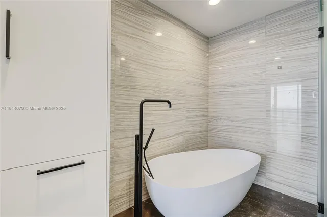 a bathroom with a double vanity sink a mirror and shower