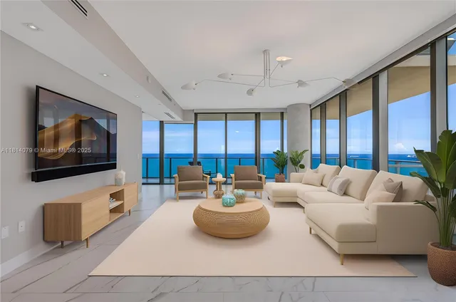 a living room with furniture and a flat screen tv