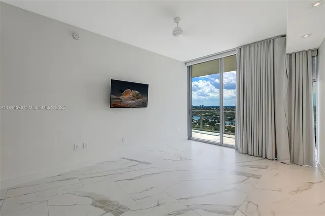 a bathroom with a shower a toilet and a sink