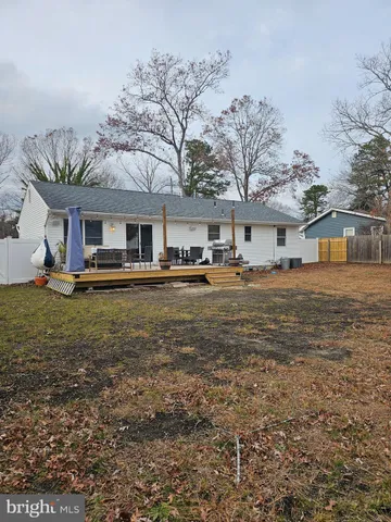 a front view of a building with a yard