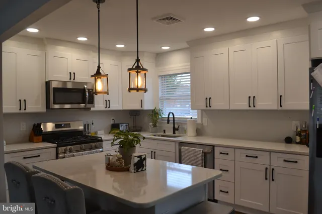 a kitchen with counter space cabinets and appliances