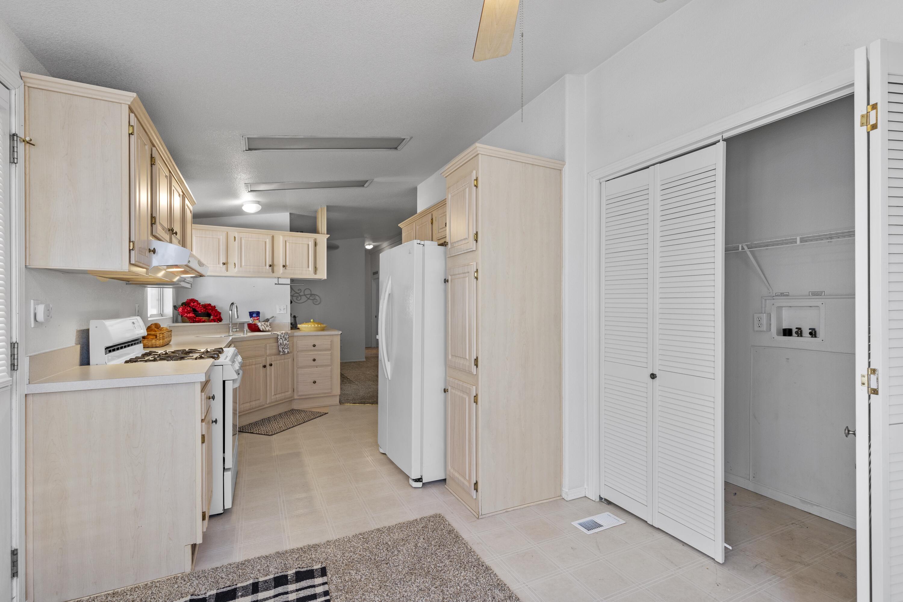 14556 East Tehachapi Boulevard Tehachapi, CA 93561 - Photo 11 of 23 a kitchen with refrigerator and cabinets