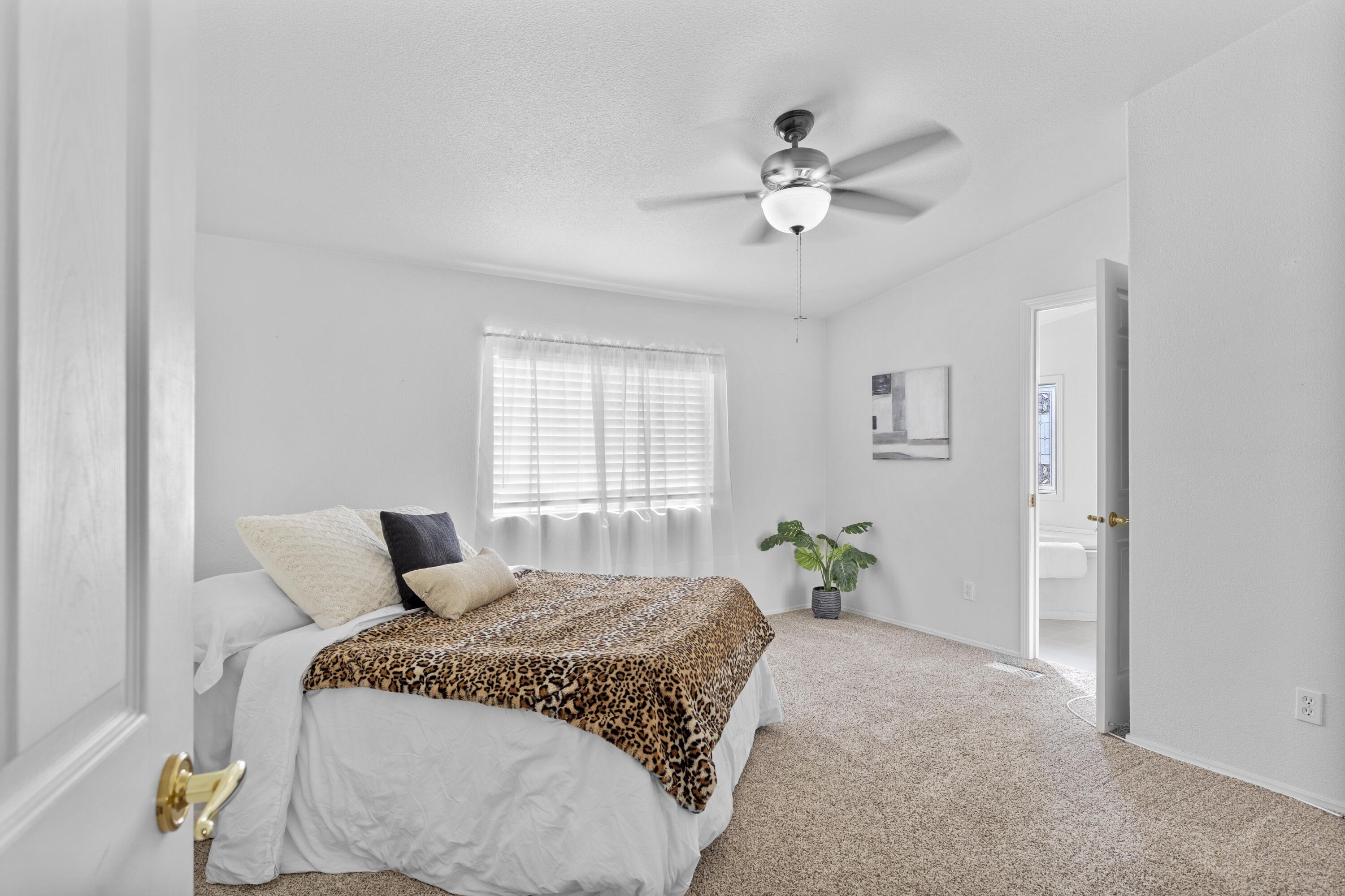 14556 East Tehachapi Boulevard Tehachapi, CA 93561 - Photo 12 of 23 a bedroom with a bed and wooden floor