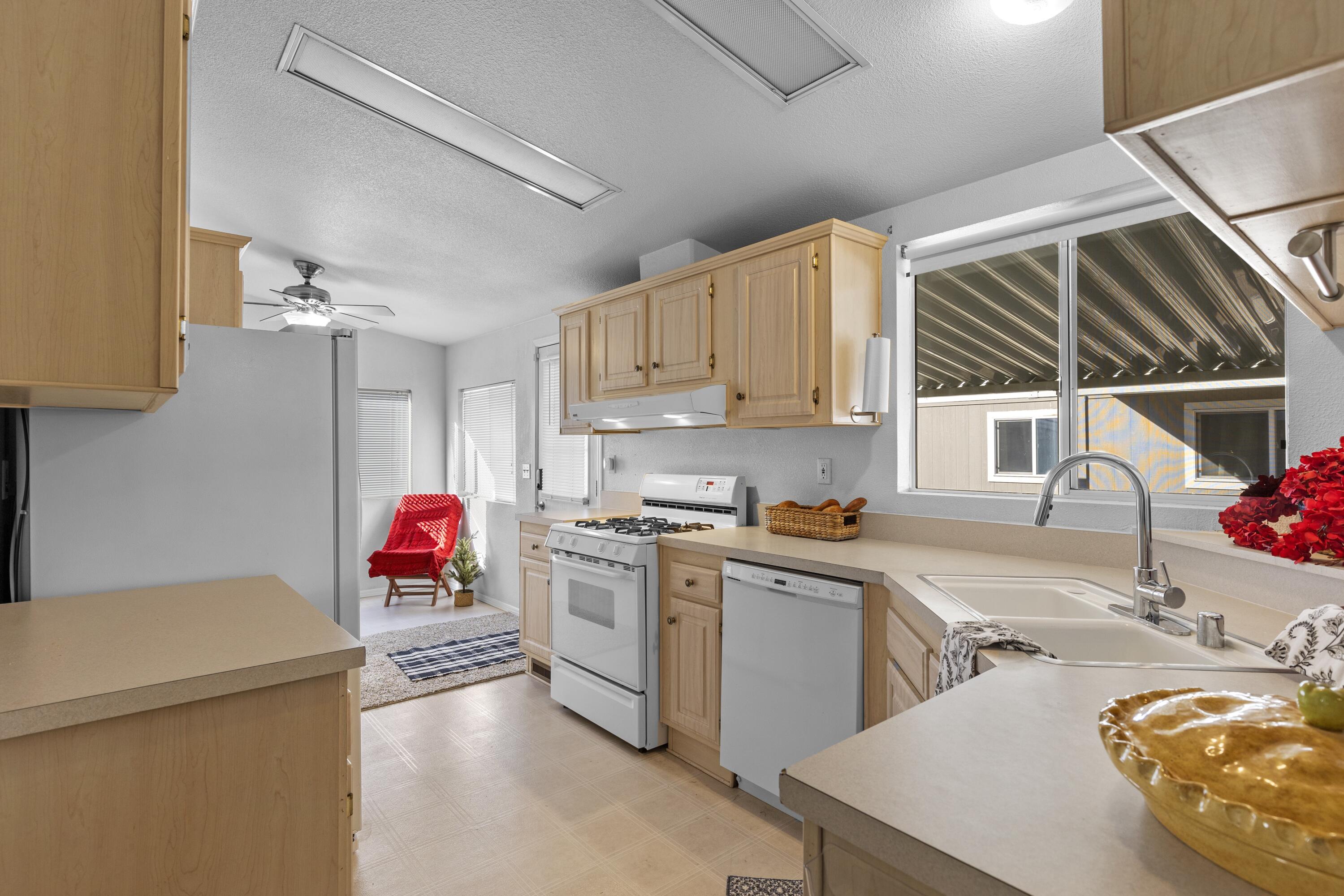14556 East Tehachapi Boulevard Tehachapi, CA 93561 - Photo 8 of 23 a kitchen that has a sink and a stove in it