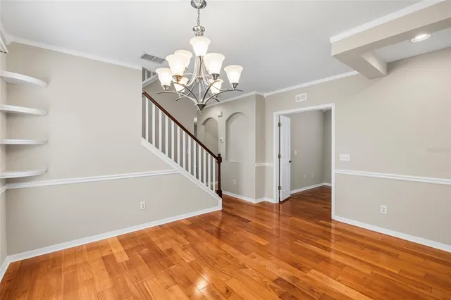 a view of a kitchen with a sink stainless steel appliances and cabinets