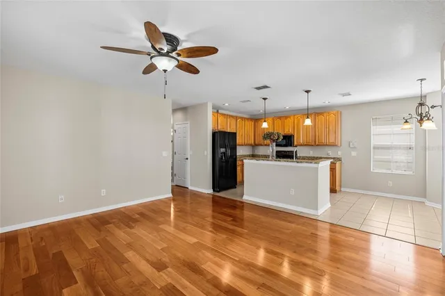 a kitchen with a stove a sink and a microwave