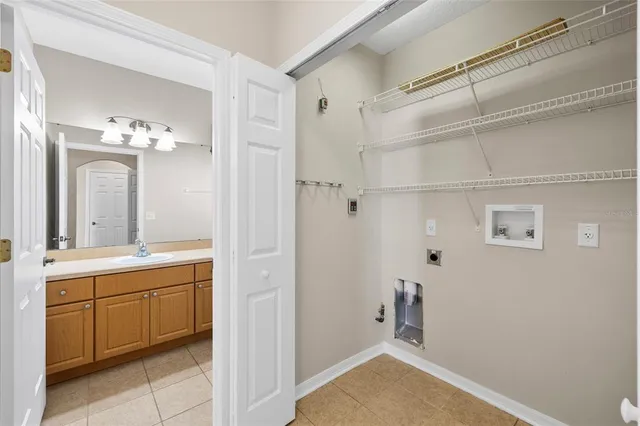 a spacious bathroom with a bathtub sink and mirror