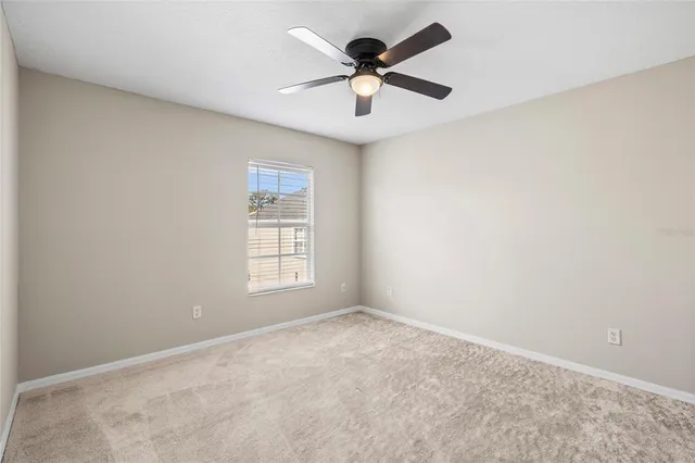 a living room with furniture a rug and a window