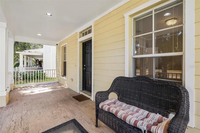 a view of a room with wooden floor and staircase