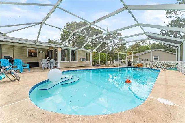 a view of a swimming pool with a patio