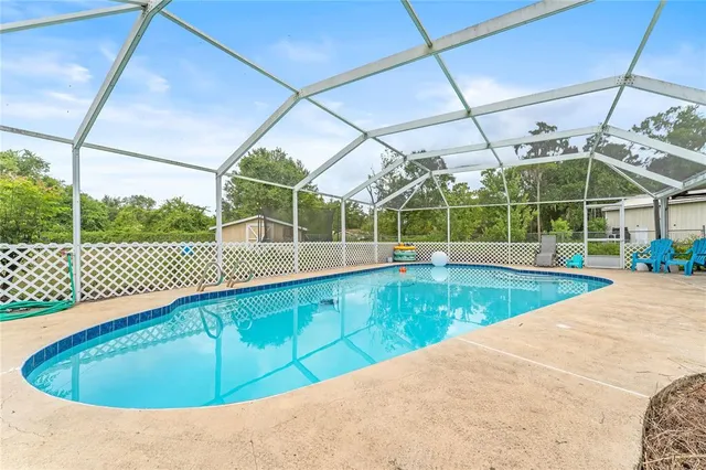 a view of a swimming pool with a patio