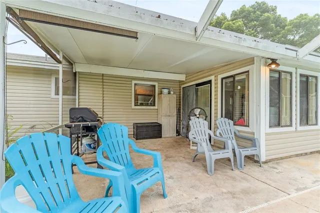 a view of a patio with a chairs in patio