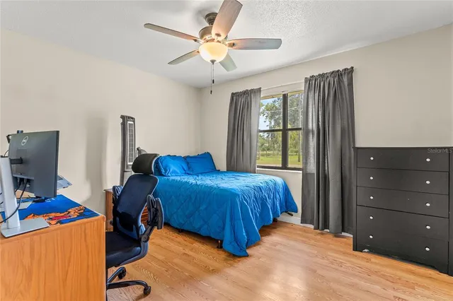 a bed room with a bed and a window