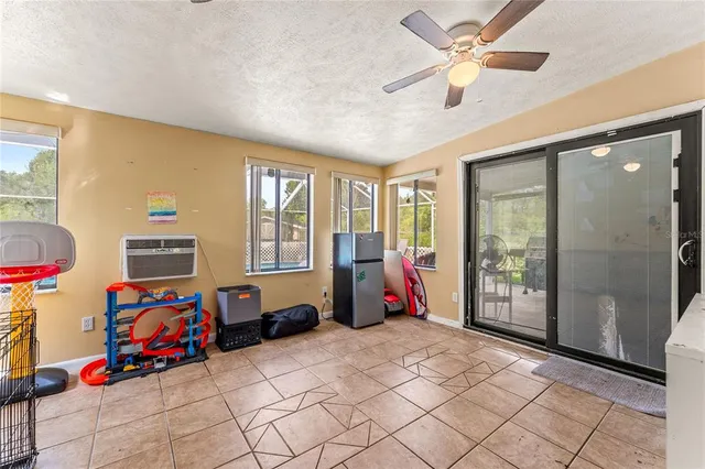 a children room with toys and a chandelier