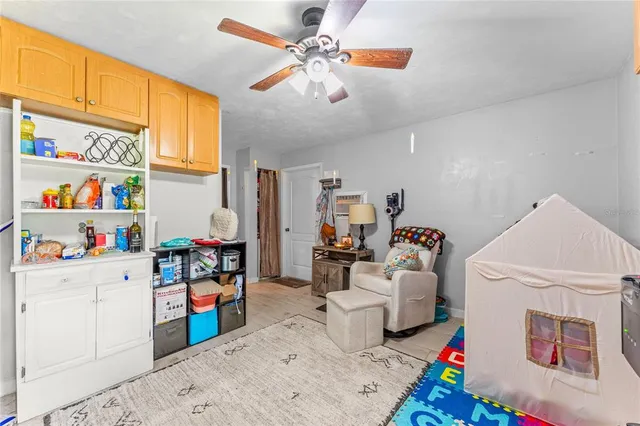 a children room with toys and a chandelier