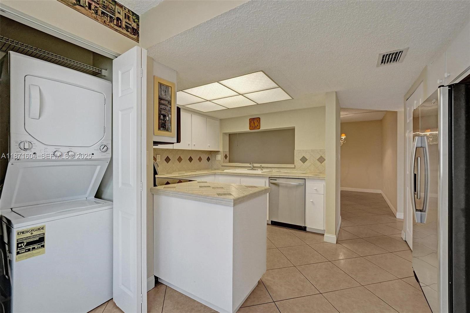 1900 Sabal Palm Drive, Unit 201 Davie, FL 33324 - Photo 12 of 23 a utility room with dryer and washer