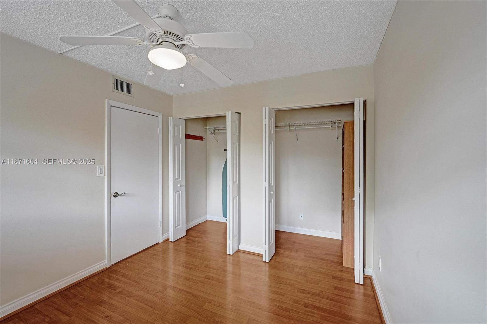 1900 Sabal Palm Drive, Unit 201 Davie, FL 33324 - Photo 15 of 23 a view of an empty room with wooden floor