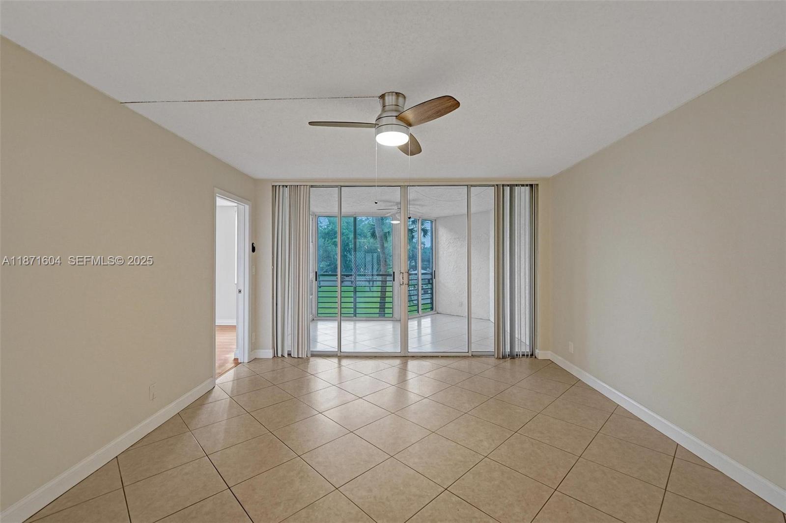 1900 Sabal Palm Drive, Unit 201 Davie, FL 33324 - Photo 4 of 23 a view of an empty room with a window