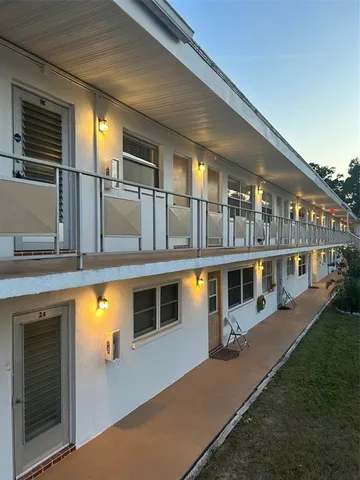 a view of a house with a swimming pool