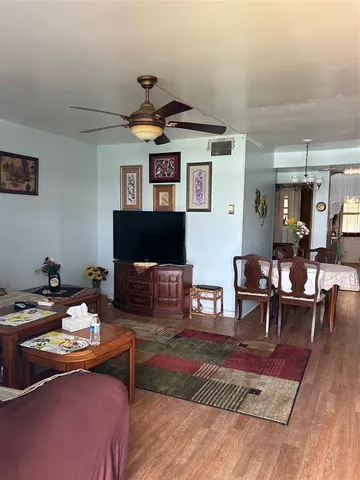 a living room with furniture and a rug
