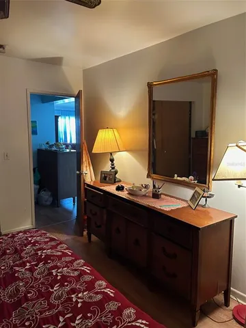 a kitchen with stainless steel appliances granite countertop a stove a sink dishwasher and cabinets with wooden floor