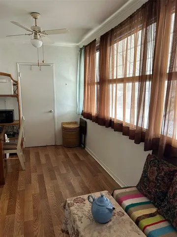 a workspace with furniture and a wooden floor