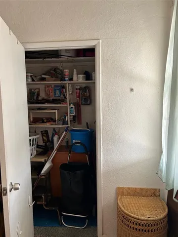 an outdoor view with a couple of cars parked