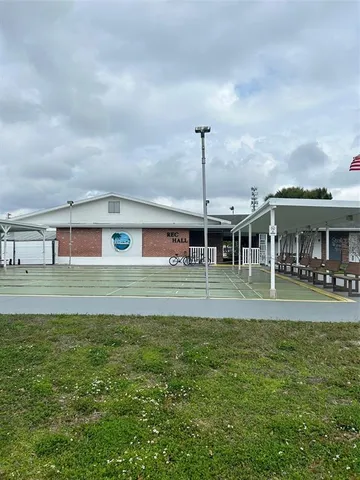 a room with furniture and a book shelf