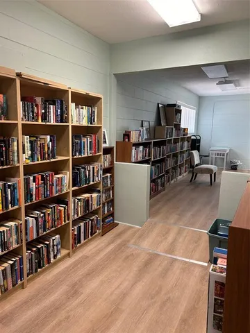 swimming pool view with a seating space