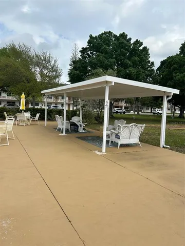 a view of a swimming pool and a yard