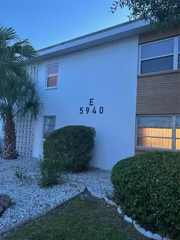 a sign that is sitting in front of a house