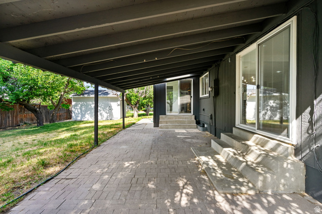 432 Calnette Drive Sandy, UT 84070 - Photo 42 of 48 Covered patio area featuring a brick paver surface
